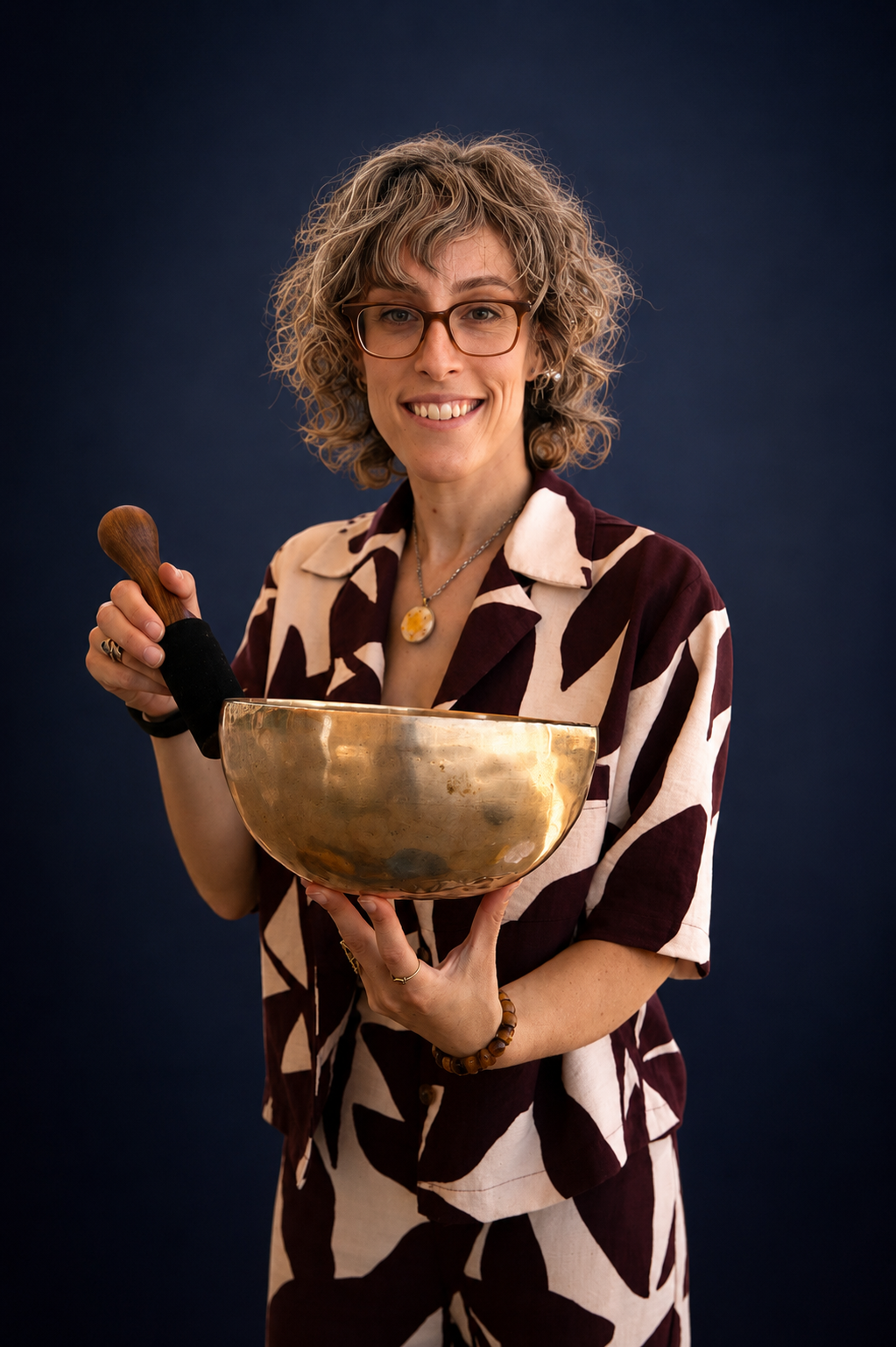Zahara Holzer holding a Tibetan singing bowl