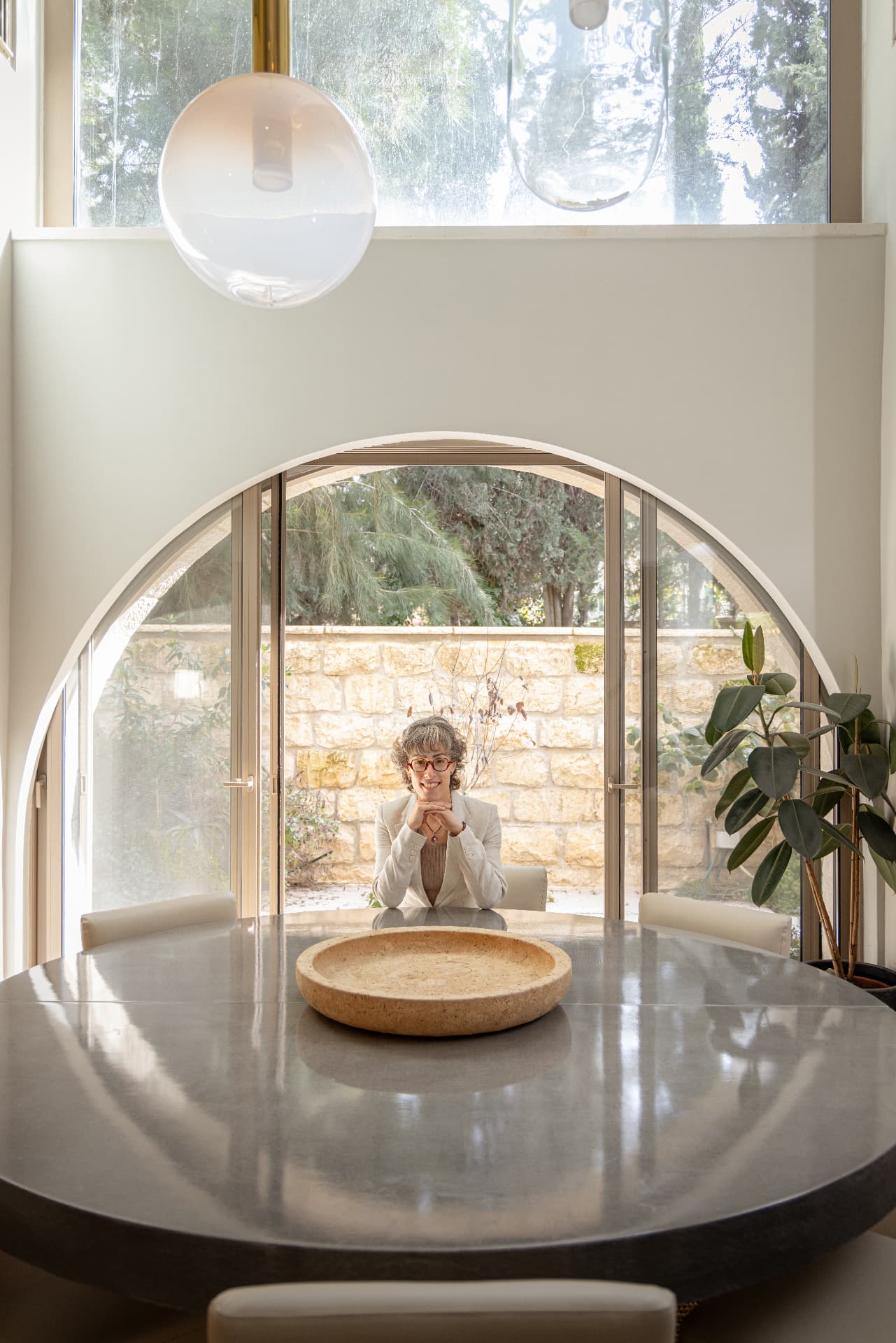 Zahara Holzer standing in an arched architectural space